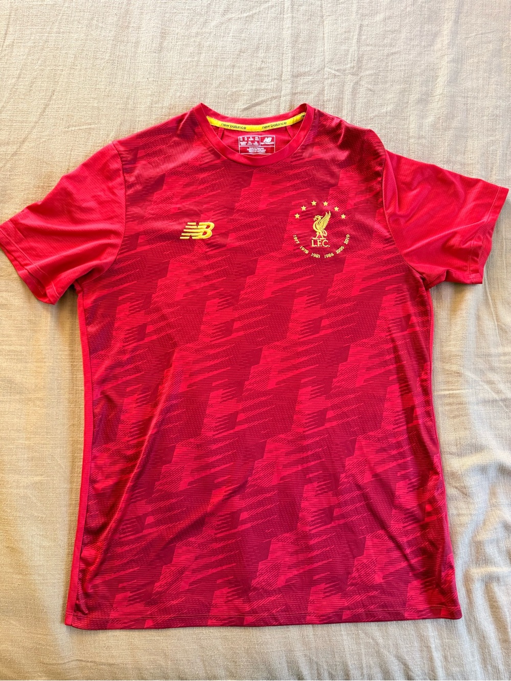 New Balance Red Liverpool FC Short Sleeve Jersey with Gold Crest training jersey